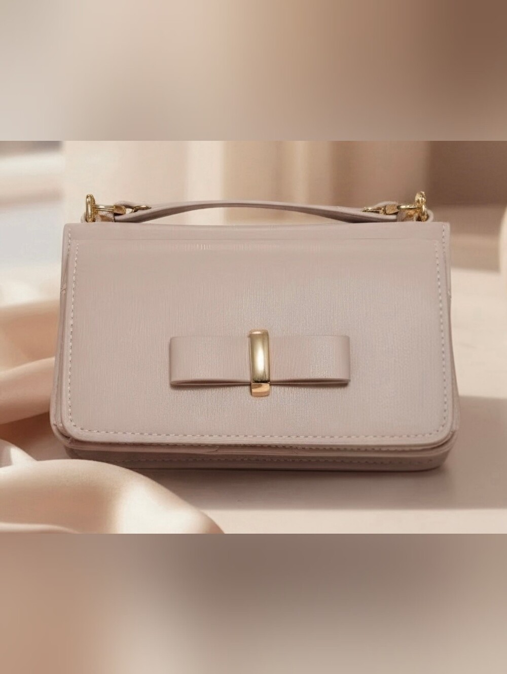 Madison West Blush Pink Mini Bag with Gold Bow Accent